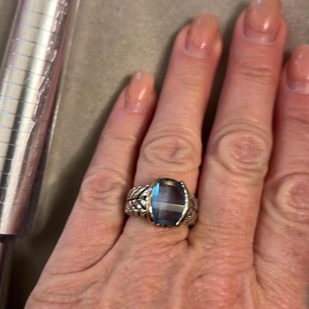 This beautiful old blue faceted stone is silver and gold is a knockout